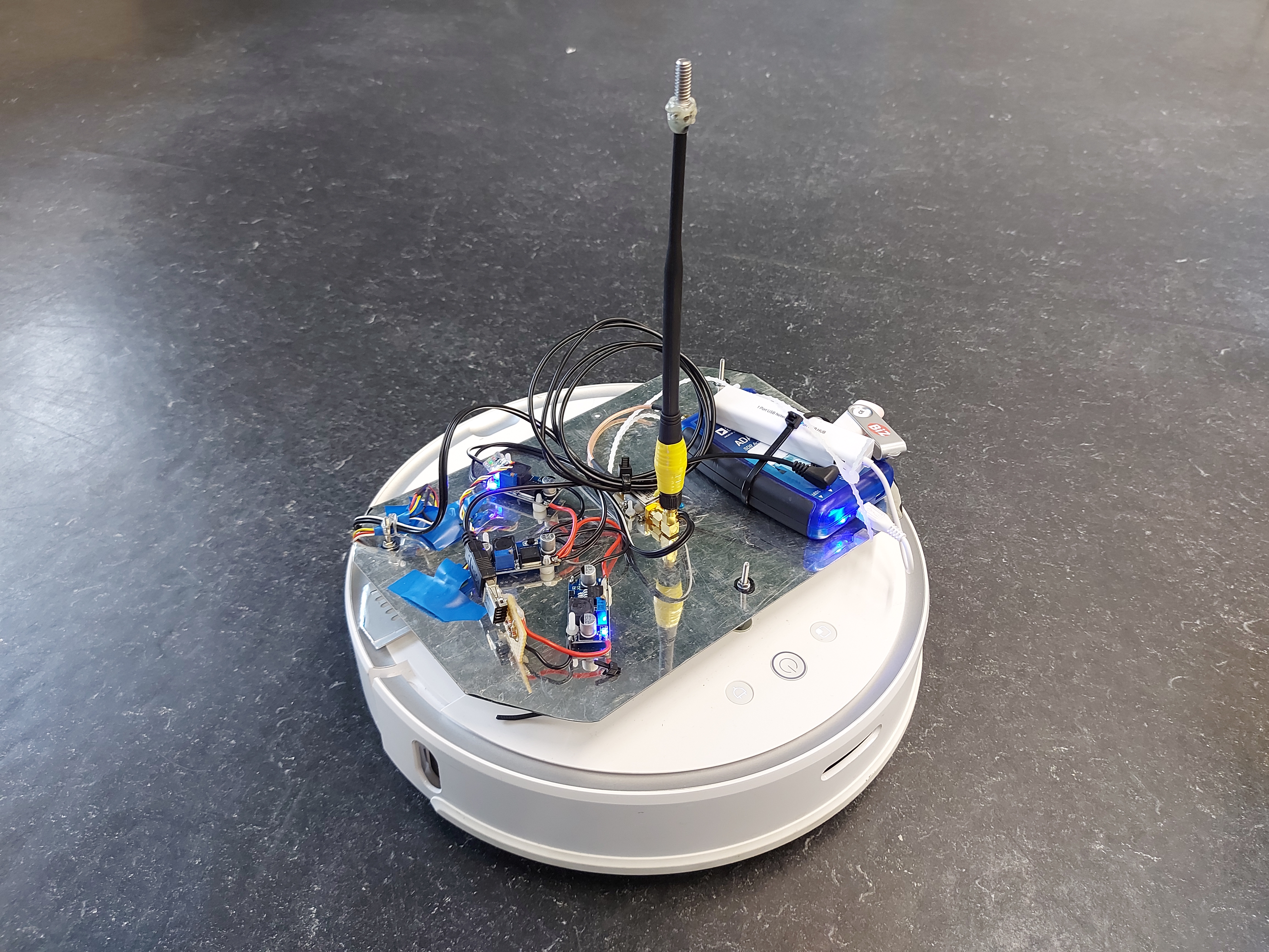 Vacuum robot on top of which PlutoSDR with transmit antenna was mounted and whose LiDAR positioning is used as ground truth label.